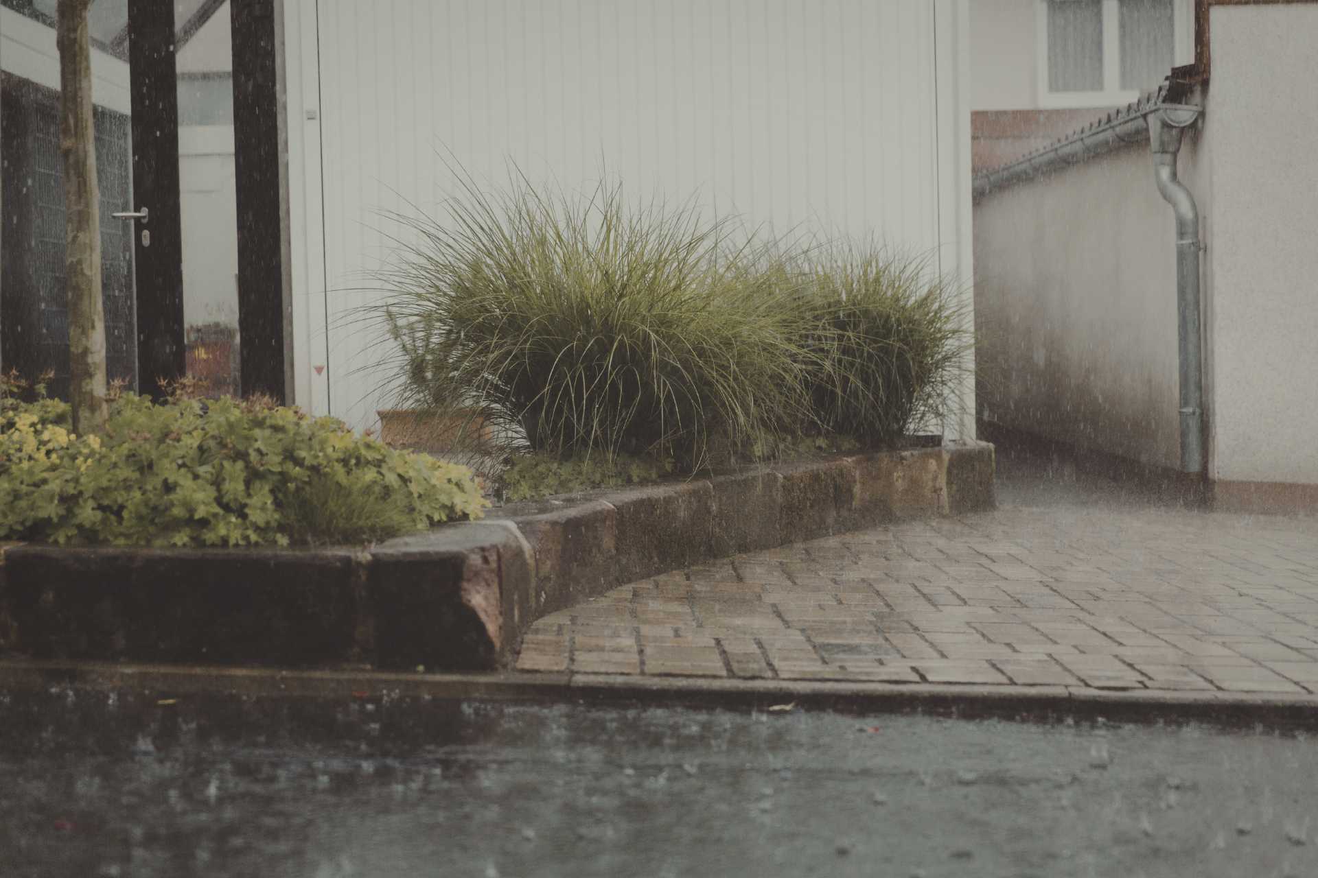 Invisible Drainage: How Trench Drains and Concrete Sloping Turn Your Driveway Into a Foundation Shield